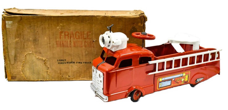 Marx Ridem Fire Truck #3320 With Original Box: Original Marx ridem fire truck #3320 with the original box. The truck has some paint loss and wear from storage and age. The truck comes with two white ladders, mechanical siren, and steering wheel. I
