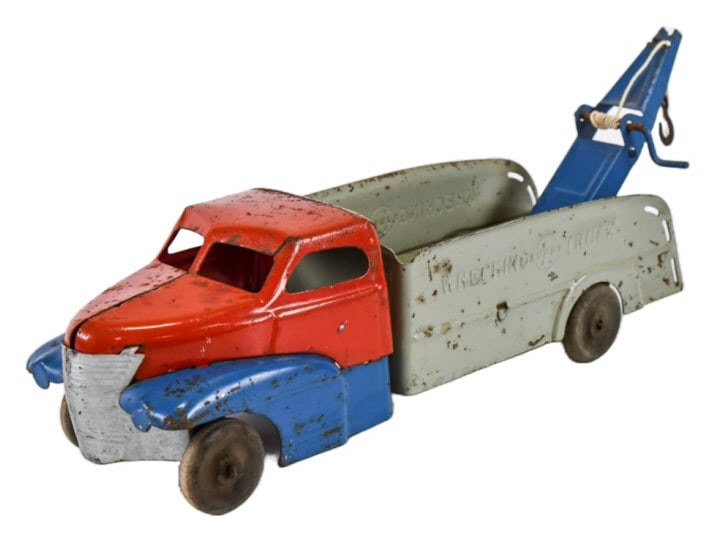 Original Buddy L Wrecking Tow Truck: Original hard to find Buddy L wrecking tow truck. The truck is in original condition with paint loss and wear from play and age. Displays well. Measures approximately 19" long.