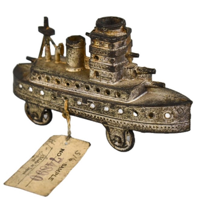 Japan Steam Boat Showroom Sample Toy: Penny toy size Japan steam boat with showroom sample tag. The tag reads Sample No. 74890 Made in Japan and with pencil 5/6 is wrote on the tag. Very nice early toy. Measures approximately 3-3/4" long.