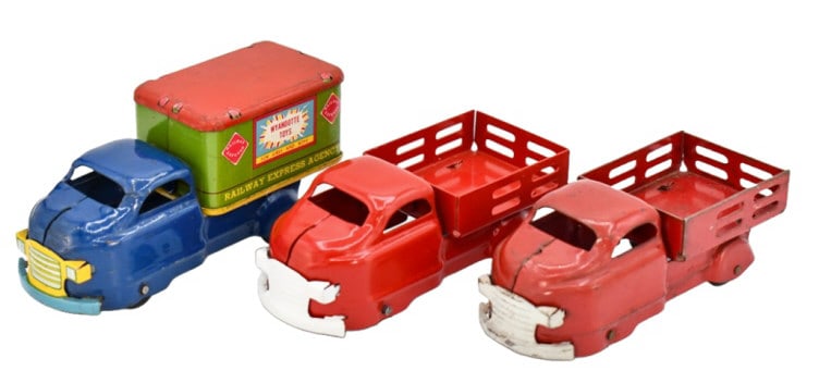 Wyandotte Railway Express & Stake Bed Trucks: Wyandotte Railway Express Agency delivery truck and (2) stake bed trucks. The one stake bed truck has been restored. The originals have some paint chips and wear from age. The Railway Express truck me