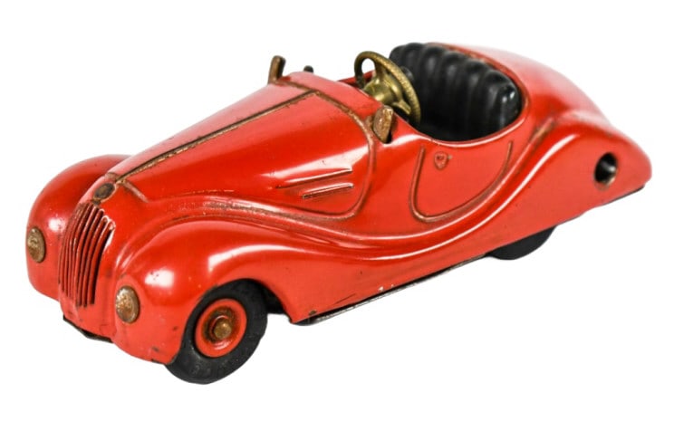 Schuco Akustico 2002 Windup Convertible Car: Schuco Akustico 2002 windup convertible car. The car is missing the windup key and windshield. It has some knicks and a dent in the rear trunk area. Measures approximately 5-1/2" long.