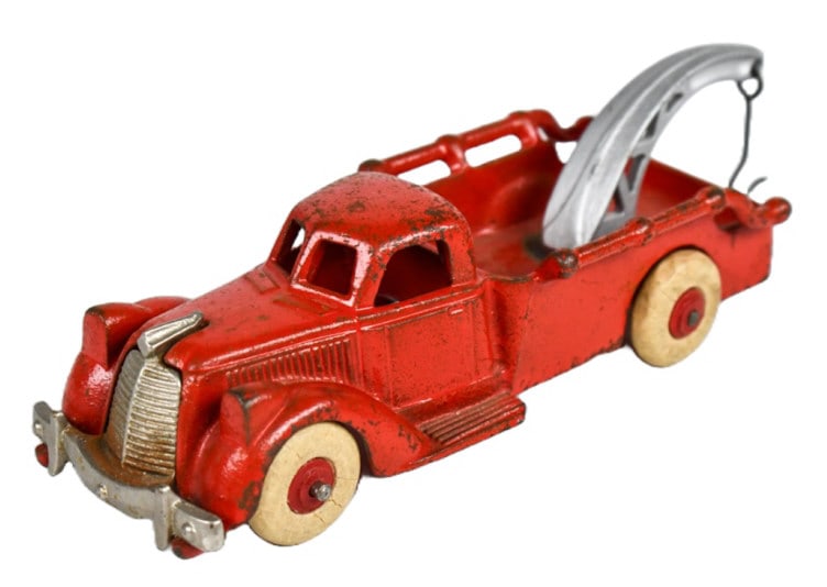 Hubley Cast Iron No. 2235 Wrecker Tow Truck: Hubley cast iron no. 2235 wrekcer tow truck. The truck has paint loss and wear from play and age. Measures approximately 7" long.