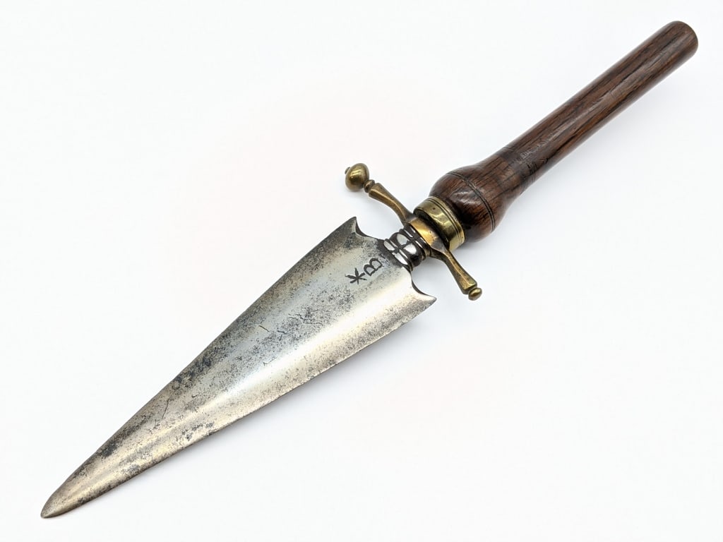 Early 1800's Spanish Plug Bayonet: Early 1800's Spanish Plug Bayonet. Knife is in aged condition and believed to have been cleaned at some point. Knife features spear head blade with various inclusions in the metal, discoloration, and