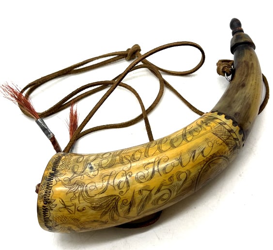 Engraved & Inked Powder Horn: Engraved & Inked Powder Horn. This reproduction Powder horn has been professionally inked. Horn has 1757 on it with scenes of people. Powder horn is in very nice used condition. Horn measures 9.5 inch