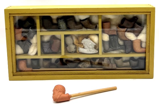 Early Settlers Clay Trade Pipes Display: Early Settlers Clay Trade Pipes Display. This Beautiful glass display case is full of early clay trade pipes that are in nice used condition. Most pipes have carvings on them.. Box measures 16 1/8 x 8