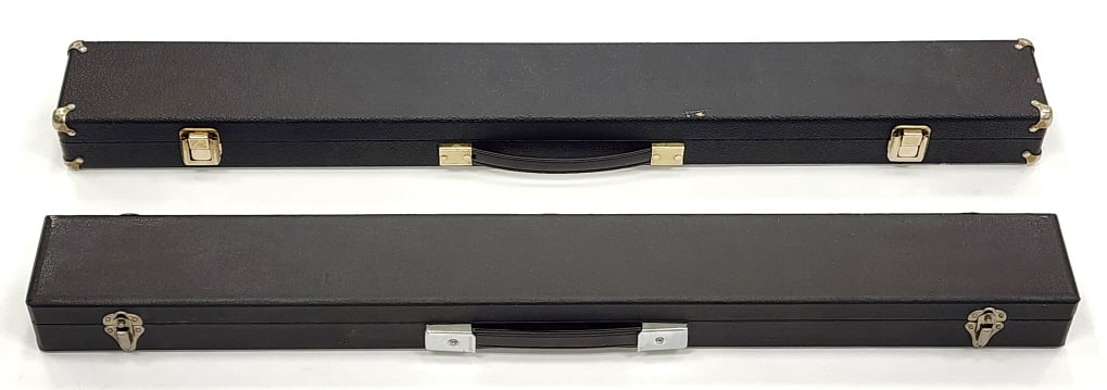 2 Hard Leather Cue Cases: 2 Hard Leather Cue Cases. Textured leather exterior with a fully lined red and black interior for a 2-piece cue. 30.75" and 31.75" in length.
