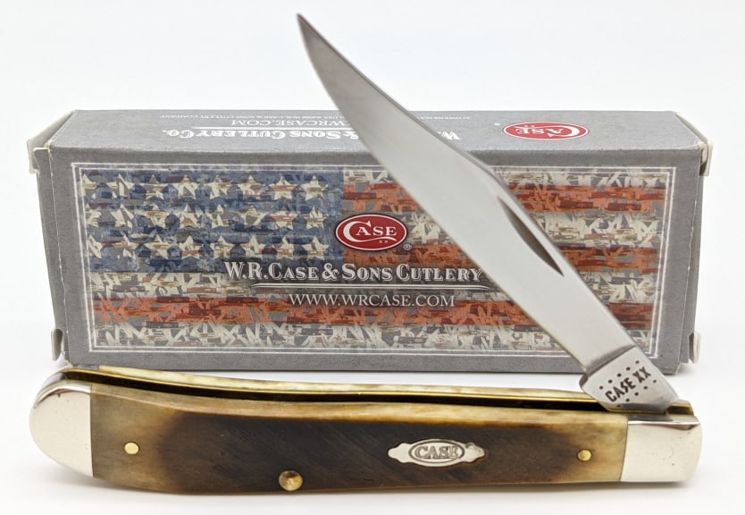 2020 Case XX Dark Bone Sawcut Slimline Trapper: 2020 Case XX Dark Molasses Bone Sawcut Jig Slimline Trapper 61048 w/ Box. Knife is in like new condition. Blade length of 3-1/2in and overall length of 7-1/2in when open.
