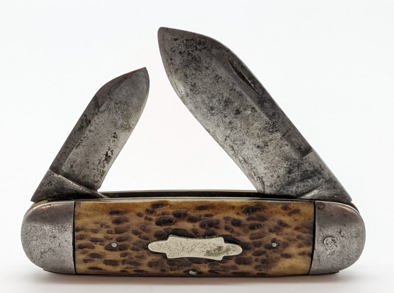 A.J. Sheffeld Cutlery Co Elephants Toe Style Knife: A.J. Sheffeld Cutlery Co Jigged Bone Elephants Toe Style Knife. Knife is in original condition with sharpening marks, material loss, and carbon spotting. Knife is in worn condition but displays well. 