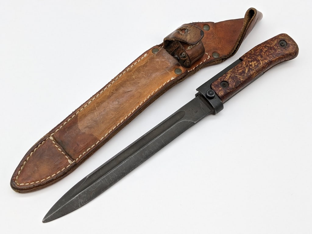 Czech VZ58 Bayonet w/ Fiber Handle & Sheath: Czech VZ58 Bayonet w/ Fiber Handle & Sheath. Knife features blackened steel blade stamped 67 and pressed fiber handle. Knife is in very nice condition. Blade length of 6-7/8in and overall length of 11
