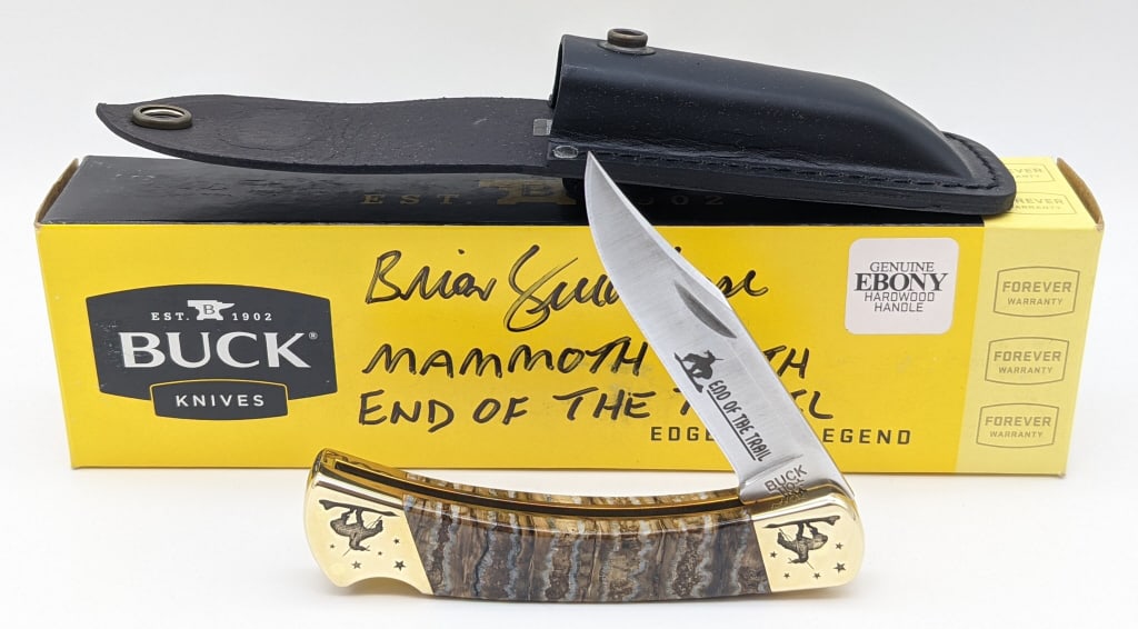 2022 Buck Custom Brian Yellowhorse Lockback Hunter: NIB 2022 Buck Custom Brian Yellowhorse End of the Trail 110 Mammoth Tooth Lockback Hunter. Knife features End of the Trail etched on the blade, brass bolsters with End of the Trail engraved, and mammo