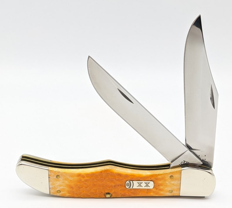 2013 Case XX Yellow Jig Bone Folding Hunter 6265: 2013 Case XX Yellow Jig Bone Large Folding Hunter 6265. Knife features shotgun shell shield. Knife is in very nice condition with minor wear on the bolsters from handling. Blade length of 4-3/8in and