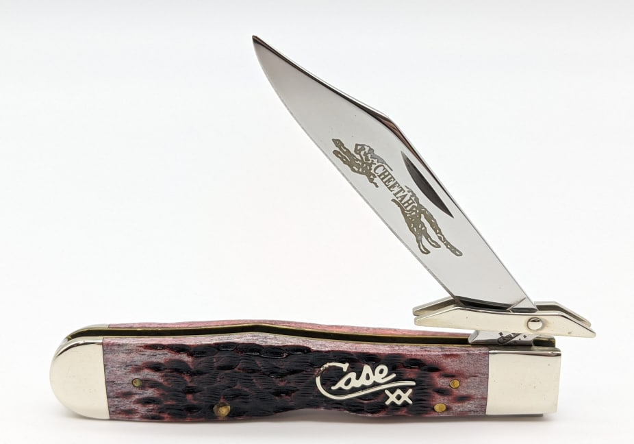 2002 Case XX Cranberry Bone Silver Script Cheetah: 2002 Case XX Cranberry Jig Bone Silver Script Cheetah. Knife is in near new condition with minor wear from handling.