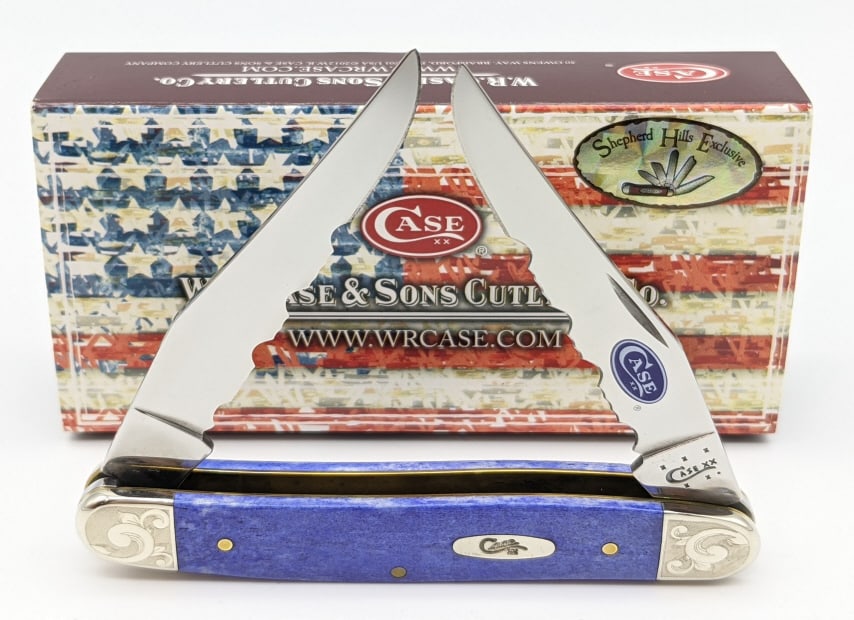 2014 Case XX Ultra Violet Smooth Bone Muskrat: 2014 Case XX Ultra Violet Smooth Bone Muskrat w/ Serrated Blades & Case. Knife features Case XX logo on the serrated blade with production number 087 and scrolled bolsters. Knife is in like new condit