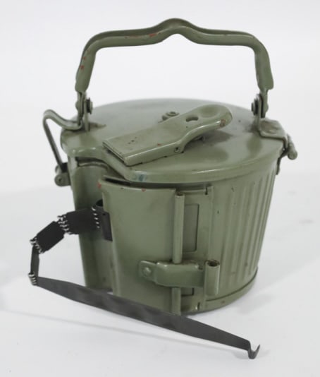WWII German MG 34/42 Drum Magazine: WWII German MG 34/MG42 50 round belt drum magazine. The magazine has no visible markings. Magazine is in original condition loaded with 8mm cartridges.