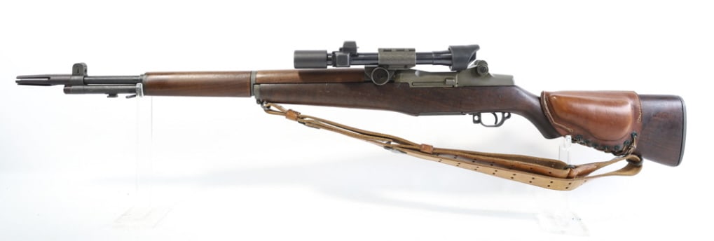 Springfield Armory .30-06 U.S. M1 Garand Rifle: 1944 WWII Springfield Armory U.S. M1 Garand semi-automatic rifle in .30-06 Springfield. The rifle is in nice used condition and the barrel measures 24" long. Comes with flash hider, leather sling, lea