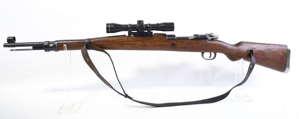 Yugoslavian Mauser M48A 8mm Bolt Action Rifle: Zastava Yugoslavian Mauser M48A bolt action rifle in 8mm. The rifle has a 23.5" barrel and is in nice condition with use and age wear. Bore and rifling are good. Comes with NcStar 4x32E scope and leat