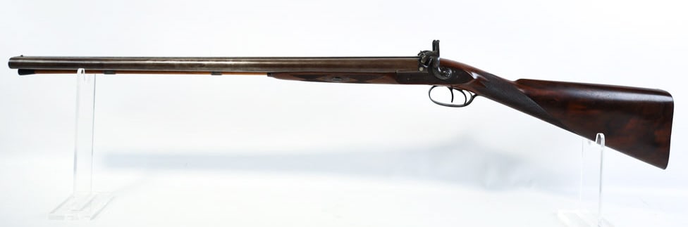 1853 Purdey 14 Ga. Side By Side Percussion Shotgun: 1853 English J. Purdey side by side percussion shotgun in 14 gauge. The shotgun is in nice antique condition with 30" Damascus barrels. Comes with a letter from the Purdey factory. The gun was built f
