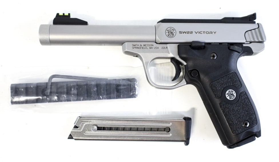 Smith & Wesson SW22 Victory 22 LR Semi-Auto Pistol: Smith & Wesson SW22 Victory semi-automatic pistol in .22 LR. The satin stainless pistol is in great near new condition and has a 5.5 threaded barrel. Comes with two magazines and rail. SN: UDW8367. Re
