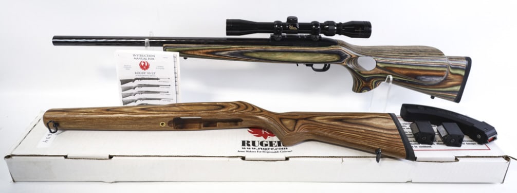 Ruger Model 10/22 .22 LR Semi-Auto Rifle In Box: Ruger Model 10/22 semi-automatic rifle in .22 Long Rifle. The rifle has a 20" hammer forged heavy barrel and is in near new condition. Comes in the original box with two stocks, four magazines, lock,