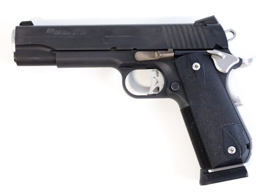 Sig Sauer 1911 .45 Auto Semi-Automatic Pistol: Sig Sauer 1911 semi-automatic pistol in .45 Auto. The flat black finish pistol is in very nice used condition and has a 5" barrel. SN: 54A010847. FFL transfer required. (896-9)