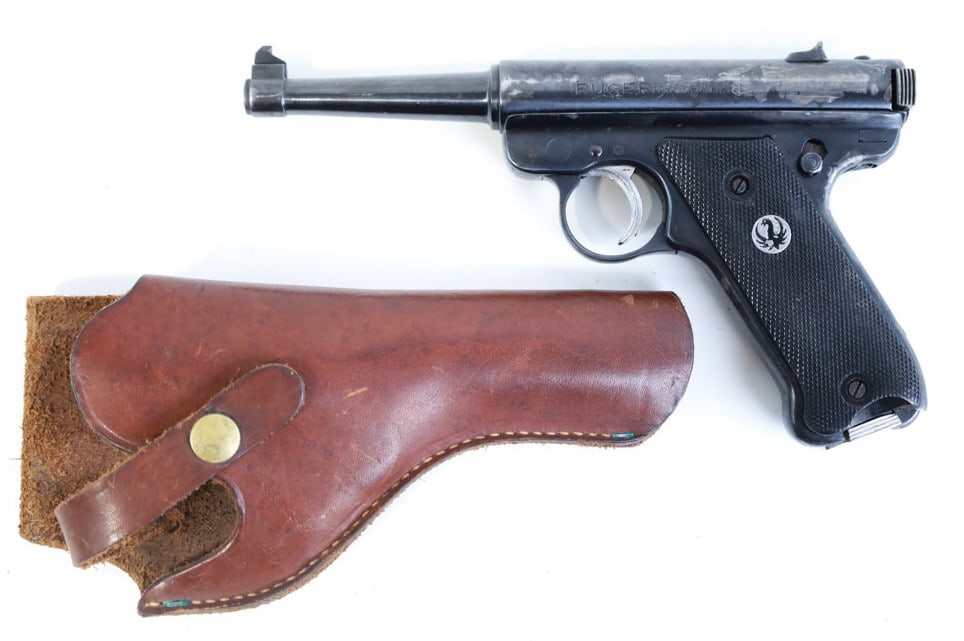 Ruger Standard .22 LR Semi-Auto Target Pistol: Ruger Standard semi-automatic target pistol in .22 Long Rifle. The blued pistol is in good condition with use wear and has a 4.75" barrel. Comes with leather Bauer holster. SN: 11-32454. FFL transfer 