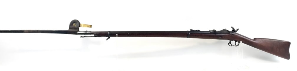 U.S. Springfield Model 1873 Trapdoor Rifle: U.S. Springfield Model 1873 .45-70-500 caliber trapdoor rifle with a 32.5" barrel. The lock is stamped "U.S. Springfield" and "U.S. Model 1873" on the door. Comes with "US" marked bayonet with scabbar