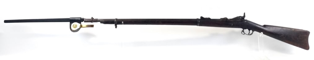 U.S. Springfield Model 1873 Trapdoor Rifle: U.S. Springfield Model 1873 .45-70-500 caliber trapdoor rifle with a 32.5" barrel. The lock is stamped "U.S. Springfield" and "U.S. Model 1873" on the door. Comes with "US" marked bayonet, scabbard an