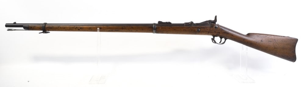 U.S. Springfield Model 1873 Trapdoor Rifle: U.S. Springfield Model 1873 .45-70-500 caliber trapdoor rifle with a 32.5" barrel. The lock is stamped "U.S. Springfield" and "U.S. Model 1873" on the door. Comes with ramrod, rear sight, and a "B" st