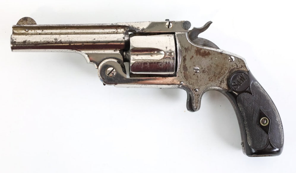 Smith & Wesson Model 1-1/2 .38 S&W Revolver: Smith & Wesson Model 1-1/2 five-shot revolver in .38 S&W. The nickel finish revolver has a 3.25" barrel and is in good condition with use and age wear. SN: 44416.