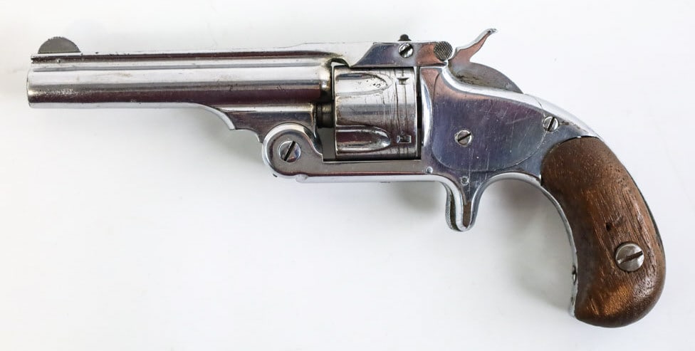 Smith & Wesson Model 1-1/2 .32 S&W Revolver: Smith & Wesson Model 1-1/2 five-shot revolver in .32 S&W. The nickel finish revolver has a 3.5" barrel and is in good condition with use and age wear. SN: 31236.
