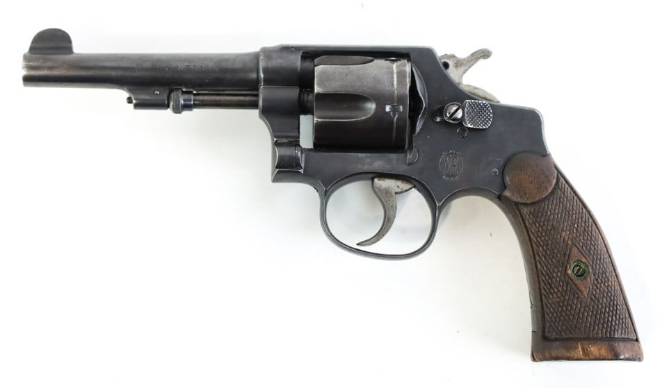 Smith & Wesson Hand Ejector .38 S&W Revolver: Smith & Wesson Hand Ejector 6-shot revolver in .38 S&W. The blued revolver has a 4" barrel and is in nice condition with use wear. SN: 36299. FFL transfer required. (1066-9)
