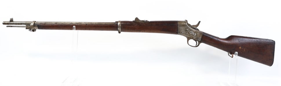 Remington Mdl 1902 7mm Mauser Rolling Block Rifle: Remington Model 1902 rolling block rifle in 7mm Mauser. The rifle is in fair condition with use and age wear and has a 30" barrel. No serial number. FFL transfer required. (1071-9)