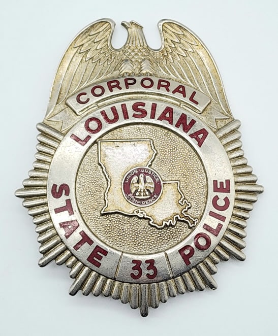 Obsolete Louisiana Corporal State Police Badge #33: Obsolete Louisiana Corporal State Police Badge #33. Nice large badge with eagle topper. Measures 3-1/2in.