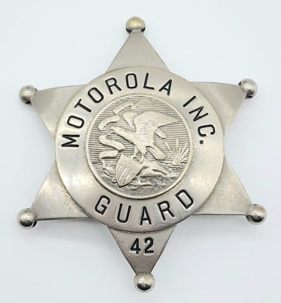 Obsolete Motorola Inc. Guard Badge #42: Obsolete Motorola Inc. Guard Badge #42. Badge is in nice condition with ball point tips and pin back, and is marked C.H. Hanson Co. Chicago. Measures 2-5/8in.