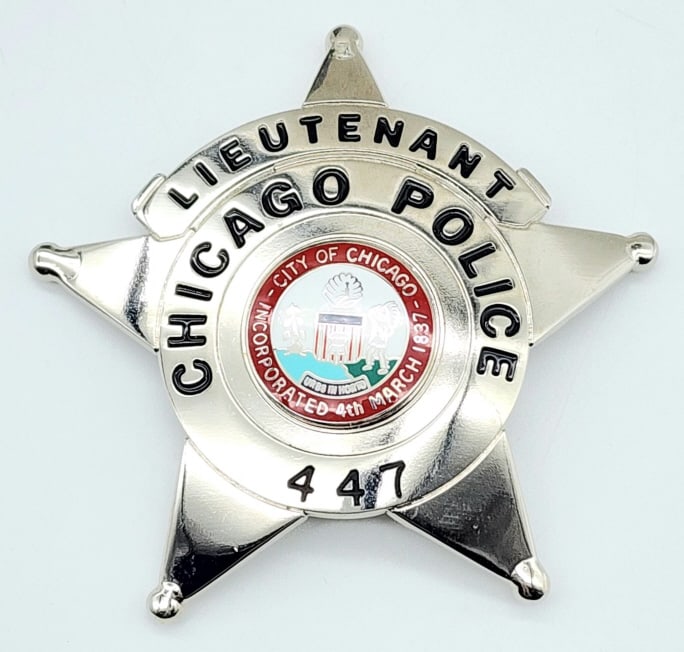 Obsolete City of Chicago Police Lieutenant's Badge: Obsolete City of Chicago Police Lieutenant's Badge #447. Badge is in nice condition with ball point tips, pin back, and is unmarked. Measures 3in.