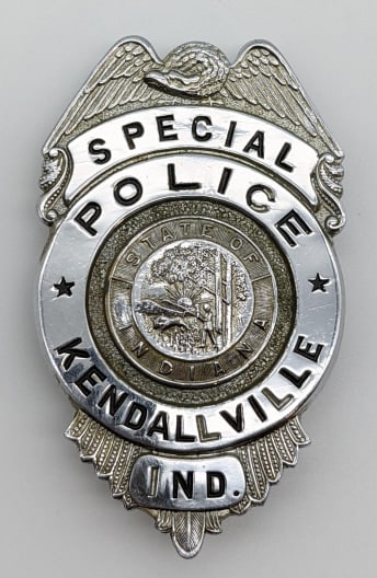 Obsolete Kendallville Indiana Special Police Badge: Obsolete Kendallville Indiana Special Police Badge. Badge is in nice condition with some finish loss, eagle topper, pin back, and is marked with the pattent number. Measures 2-5/8in.