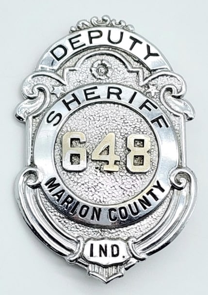 Obsolete Marion County Deputy Sheriff Badge #648: Obsolete Marion County Indiana Deputy Sheriff Badge #648. Badge is in nice condition with some light wear from use, pin back, and is unmarked. Measures 2-5/8in.