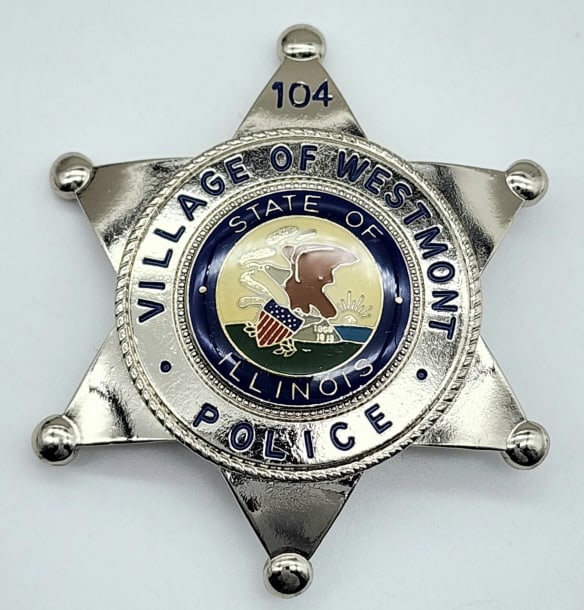 Repro. Westmont Illinois Police Badge #104: Repro. Westmont Illinois Police Badge #104. Badge is in very nice condition with pin back and is marked with GODE makers marks. Measures 2-1/2in.