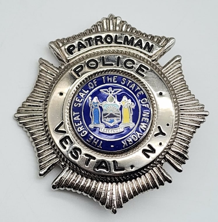 Repro. Vestal NY Police Patrolman Badge: Repro. Vestal NY Police Patrolman Badge. Badge is in very nice condition with pin back and is unmarked. Measures 2-1/2in.