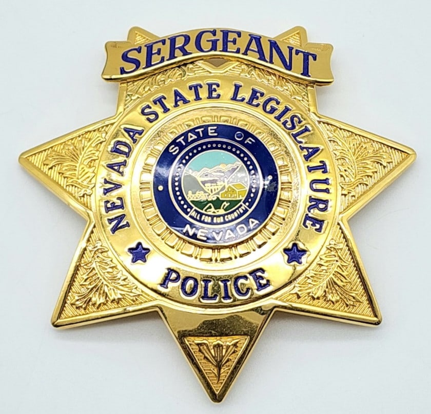 Repro. Nevada State Legislature Sergeant Badge: Repro. Nevada State Legislature Police Sergeant Badge. Badge is in very nice condition with pin back and is marked Blackinton. Measures 2-7/8in.