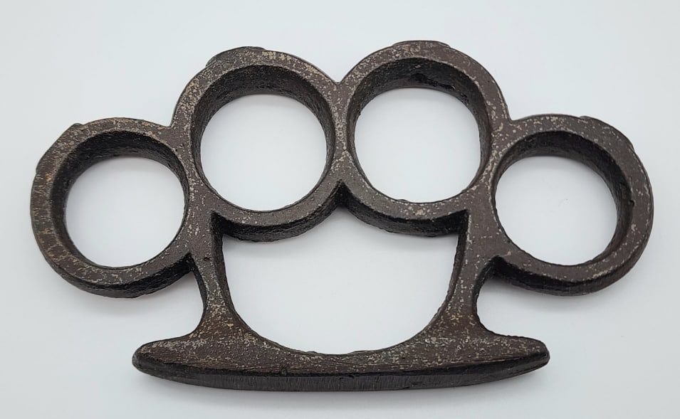 Vintage Studded Brass Knuckle Dusters: Vintage Studded Brass Knuckle Dusters. Knuckles have a studs on each finger hole and is in nice condition with casting marks and wear from age. Measures 4-5/8in across. Please check your local laws be