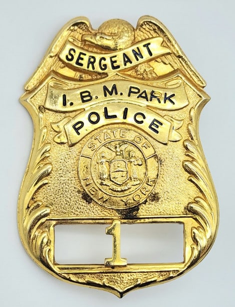 Obsolete I.B.M. Park NY Police Sergeant Badge #1: Obsolete I.B.M. Park New York Police Sergeant Badge #1. Badge is in nice condition with some wear from use, pin back, and is unmarked. Measures 3-1/4in.