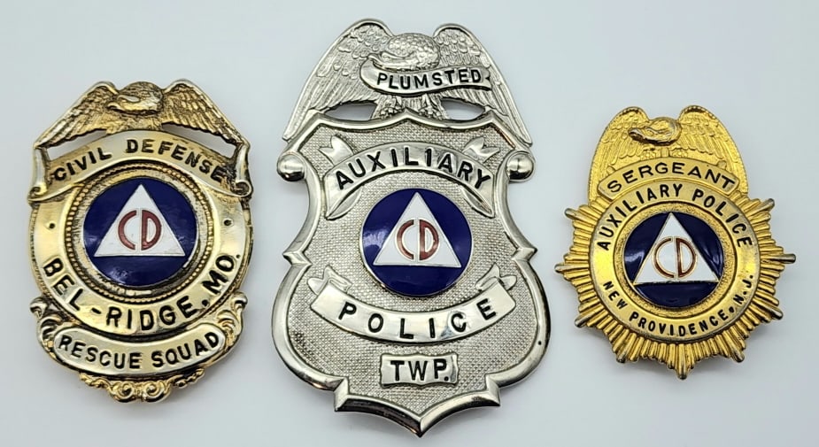 Obsolete Auxillary Police & Rescue Squad Badges: Obsolete Auxillary Police & Rescue Squad Badges. Badges are in nice condition with some wear from use, pin backs, and the rescue squad badge is marked with the pattent number. Largest measures 3-3/8in