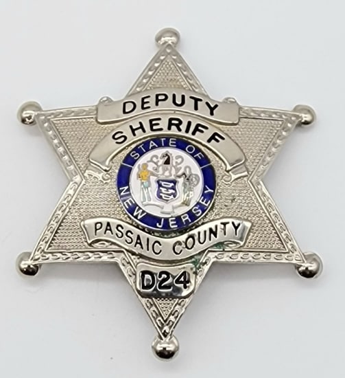 Obsolete Passaic Co. NJ Deputy Sheriff Badge #D24: Obsolete Passaic Co. NJ Deputy Sheriff Badge #D24. Badge is in very nice condition with light wear from use, pin back, and is marked Smith & Warren. Measures 2-7/8in.