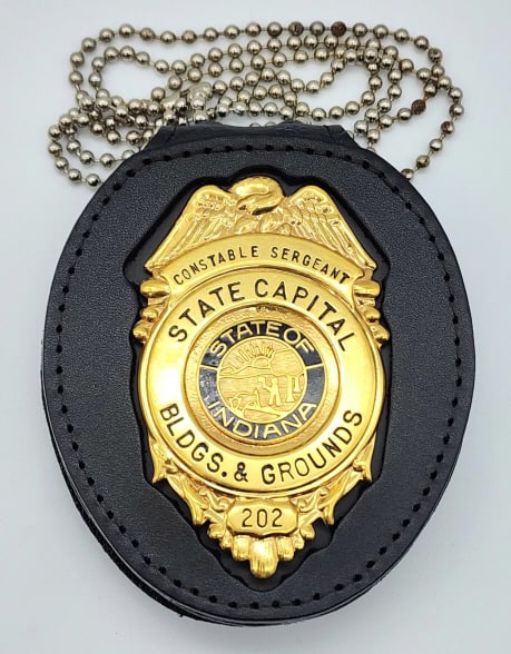 Obsolete Indiana State Capital Constable Sergeant: Obsolete Indiana State Capital Building & Grounds Constable Sergeant Badge #202 w/ Badge Holder. Badge is in very nice condition with light wear from use, pin back, and is unmarked. Measures 3in.