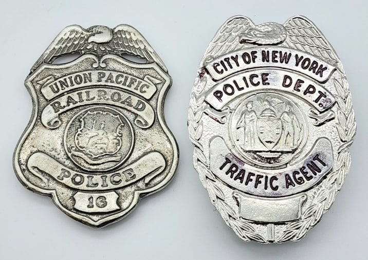 Repro Union Pacific RR and New York Police Badges: Repro Union Pacific RR and New York Police Badges. Badges are in nice condition with pin backs and the New York badge is marked replica. Largest measures 3-1/8in.
