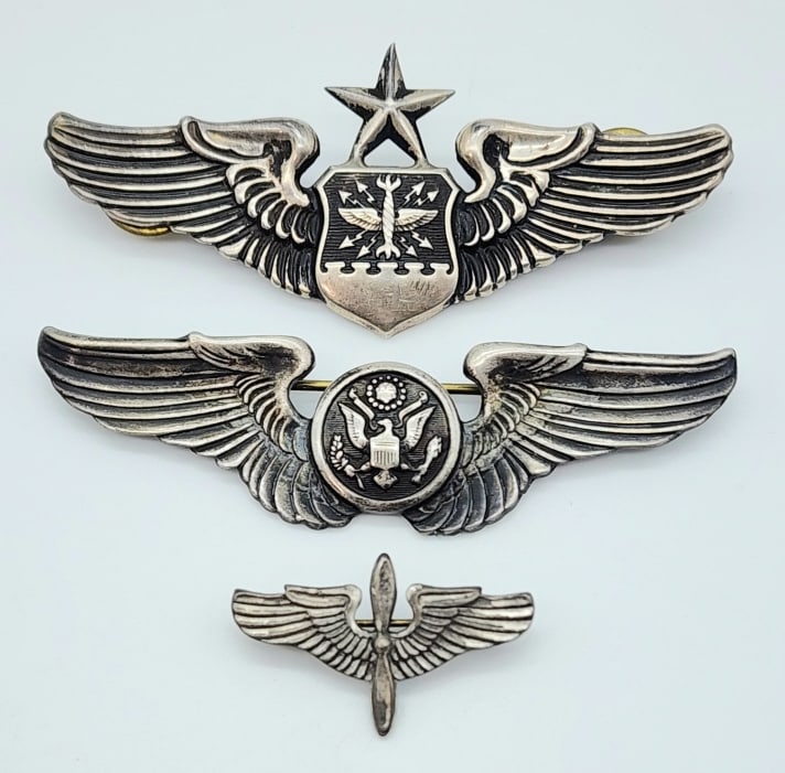 WW2 USAF Sterling Silver Navigator & Crew Wings: WW2 USAF Sterling Silver Navigator & Crew Wings. Badges are in nice condition with light wear from age. Largest measures 3in.