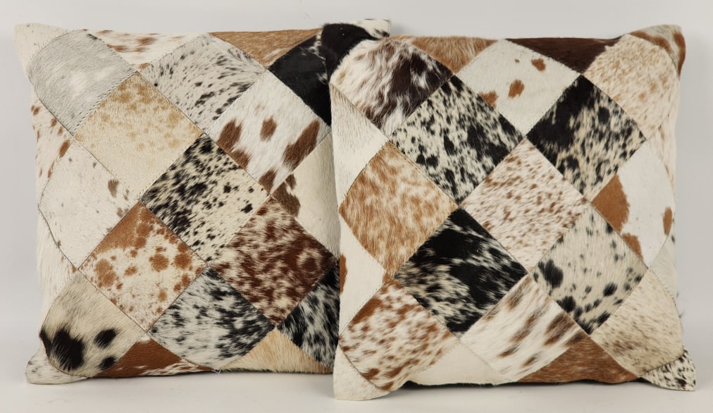 New Pair of Tri-Colored Quilted Cowhide Pillows: Brand New Pair of Tri-Colored Quilted Cowhide Pillows. Pillows are in nice new condition and display nicely. Measures approx 14in x 14in.