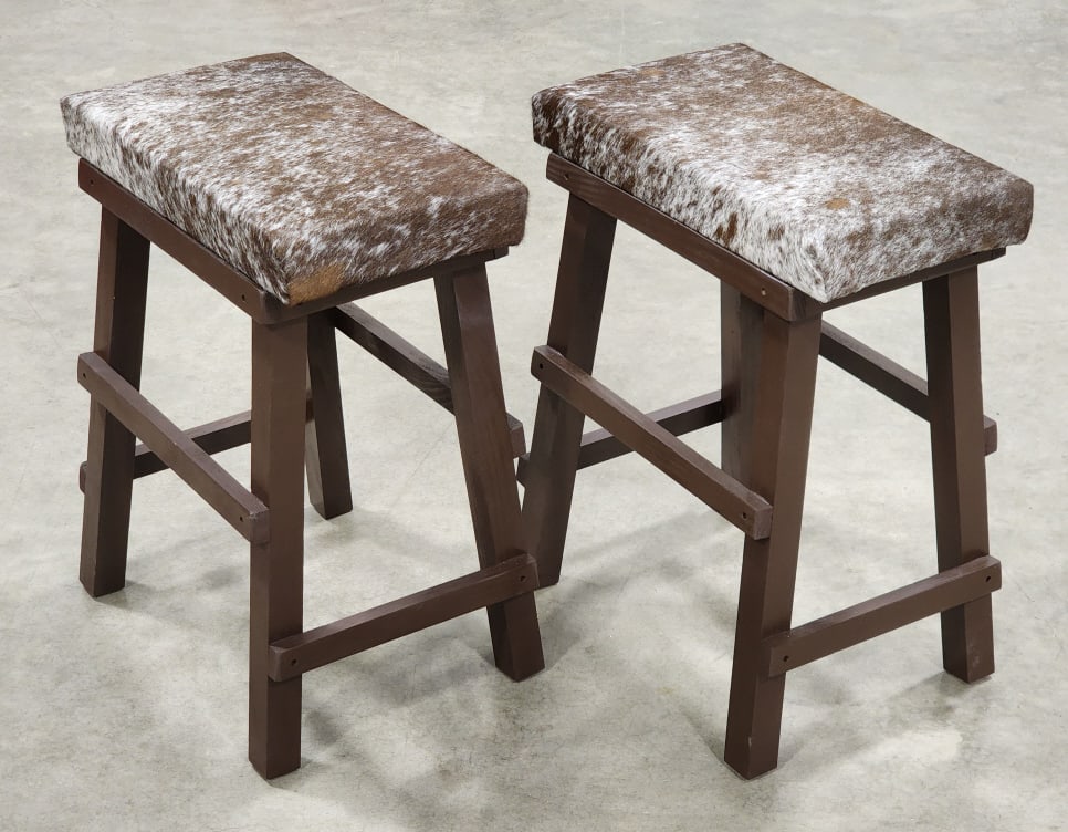New Pair of Salt & Pepper Cowhide Bar Stools: New Pair of Salt & Pepper Cowhide Bar Stools. Stools are in nice new condition and display nicely. Measures approx 18in wide x 12in deep x 23in tall.