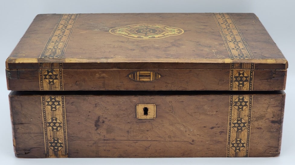 Civil War Era Folding Writing Desk w/ Ink Well: Civil War Era Folding Writing Desk w/ Ink Well. The desk features gorgeous mosaic inlay work with a felt padded writing space with inkwell and pen holding spaces. The felt pannels lift up to give acce